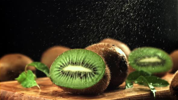 Splashes of Water Fall on the Sliced Kiwi