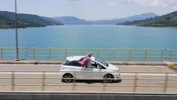 Joyful Woman in Road Trip