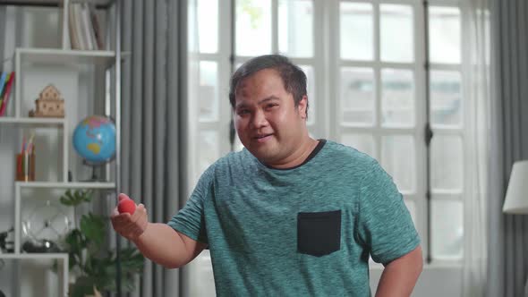 Asian Man Blogger Shoots Video Content For Social Networks, Magician With Red Ball