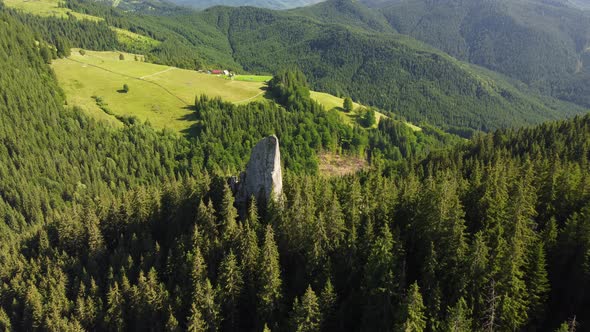 Aerial View of a Picturesque Rock Located Among the Spruce Forest in the Mountains