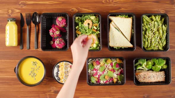 Food Delivery Top View Take Away Meals in Disposable Containers on Wooden Table