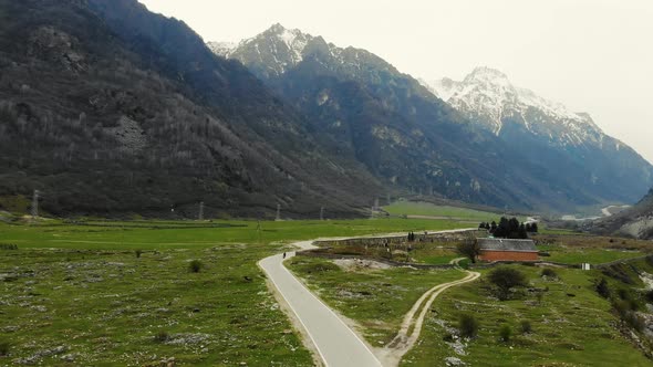 Aerial View of Valley Through Which Mountain River Flows