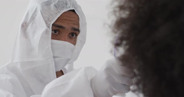 Male health worker measuring temperature with temperature gun