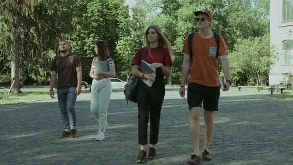 Cheerful Student Friends Going To University