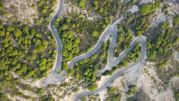 Aerial View of Winding Road in Beautiful Mountains at Sunset