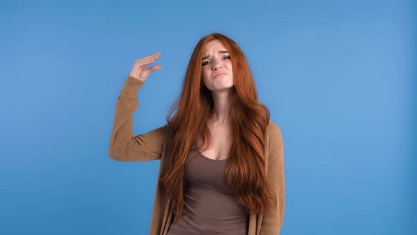 Redheaded Woman in Brown Tshirt and Cardigan