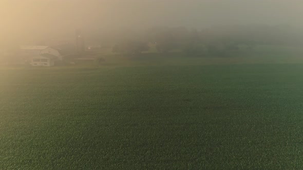 Aerial View of a Foggy Morning Looking Over Pennsylvania Farmland, Fields