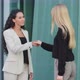 Friendly Smiling Young Diverse Female Colleagues Greeting Each Other By Handshaking - VideoHive Item for Sale