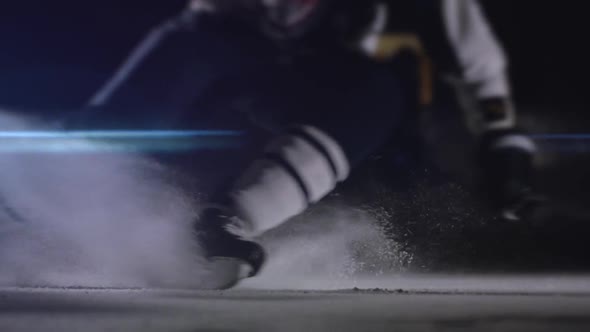 Ice Hockey Player Make Ice Sparkles on High Speed Braking