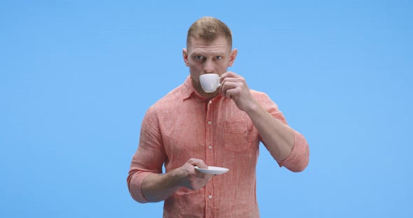 Young Man Drinking Coffee