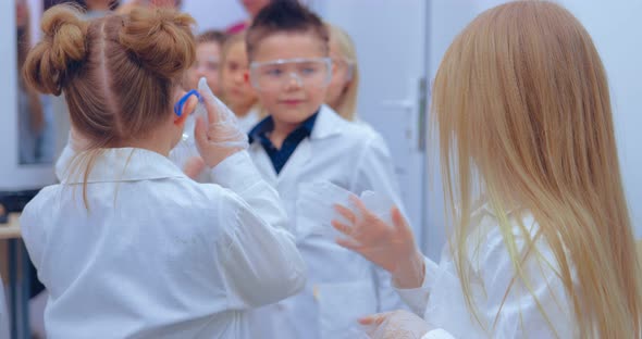 Children in the Chemistry Class are Preparing for the Lessons