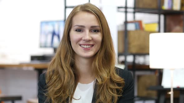 Smiling Working Girl at Work, Portrait in Office