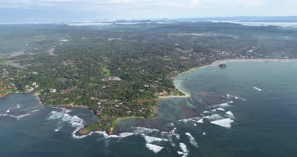 Aerial view.Drone aerial footage of ocean waves and fishermen village landscape