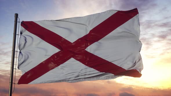 Flag of Alabama Waving in the Wind Against Deep Beautiful Sky at Sunset