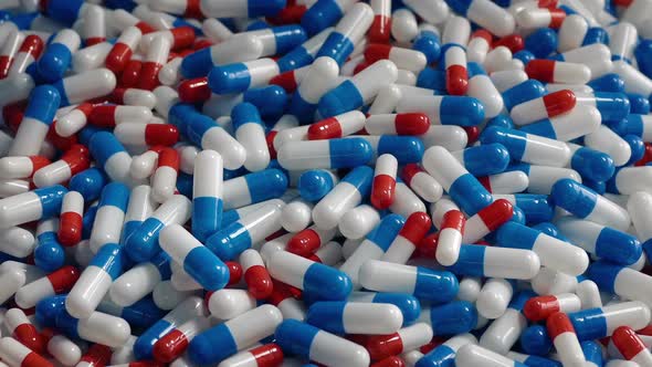 Drug Capsules Poured Into Pile - Healthcare Concept