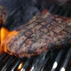 High Quality Video of Steaks on The Grill Being Grilled with Flames in Real Slow Motion 120fps - VideoHive Item for Sale