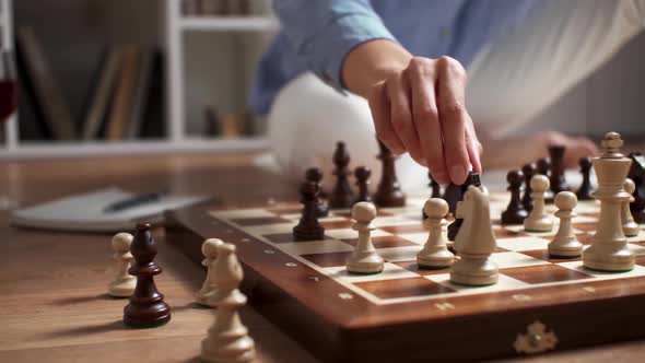 Making A Move With A Chess Piece On A Chessboard, A Girl Chess Player Makes A Move With