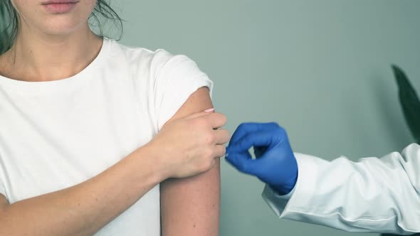 Young Woman Getting Vaccinated at the Hospital