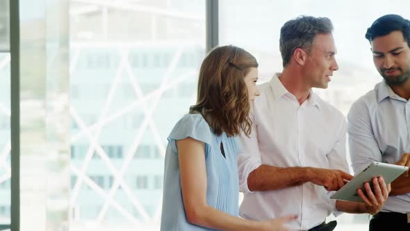 Business people working together on digital tablet in a modern office 