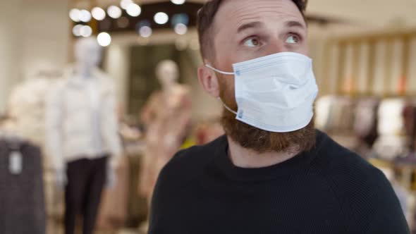 Close up video of man in protective mask in shopping mall. Shot with RED helium camera in 8K.