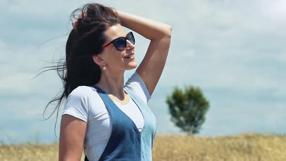 Portrait Amazing Woman in Sunglasses Enjoying Countryside Nature in Field of Wheat Dried Grass