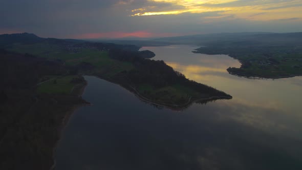 Man Made Lake Czorsztyn on Sunset, Aerial Drone View Backwards Shot