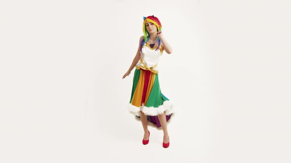 Young Caucasian Girl With Colorful Hair Flirting and Dancing White Background Full Studio Shot