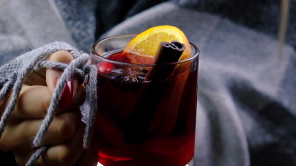 Mulled Wine in the Hands of a Woman