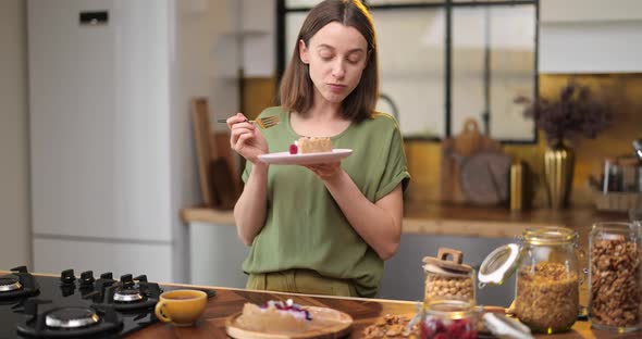 Woman Enjoys a Sweet Dessert at Home