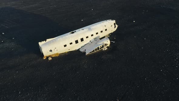 Drone Over Plane Wreck In Black Sand