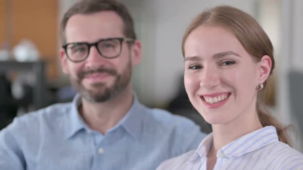 Close Up of Cheerful Young Couple Smiling at the Camera
