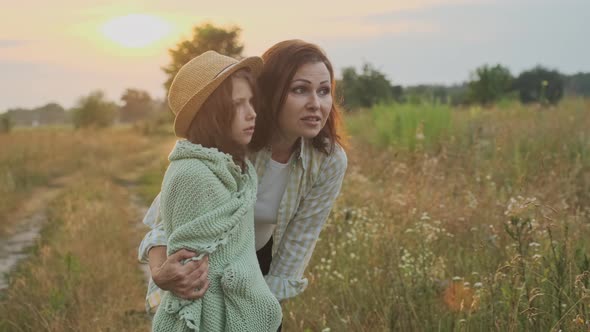 Loving Moms Puts on Daughter Knitted Blanket