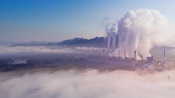 Aerial view Steam or mist over of Coal Power Plant.