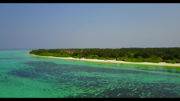 Aerial above travel of luxury resort beach vacation by blue ocean and white sandy background of a da