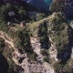 Aerial Fly Over View Of Multiple Tree House Hostels on Cliff  - VideoHive Item for Sale