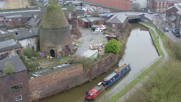 Aerial view of Kensington Pottery Works as a canal boat passes, narrow boat, the old abandoned, dere