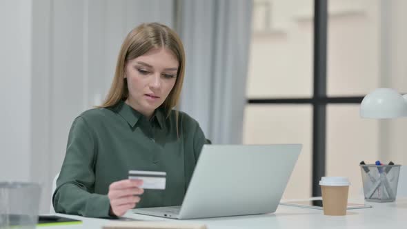 Successful Online Shopping on Laptop By Young Woman