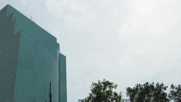 Close-up view of skyscraper of glass and steel with mirror surface