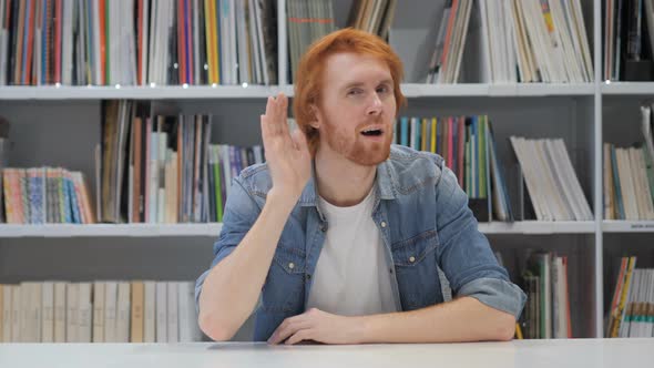 Redhead Man Listening Secret Carefully in Office