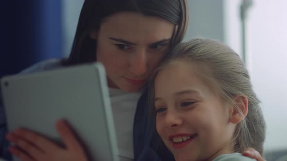 Family Enjoy Playing Tablet Computer Closeup