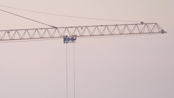 Tower Crane at High Residential Apartment Building Construction Site