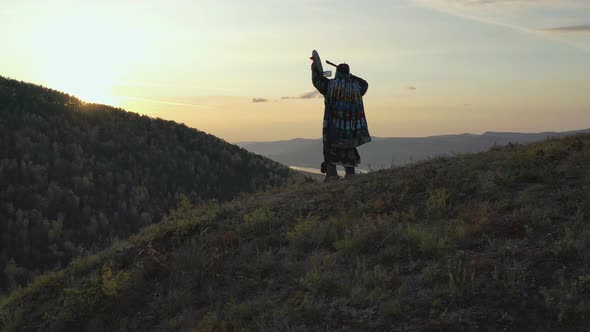 Steadicam Shot of the Forest Sorcerer Knocking on His Tambourine.