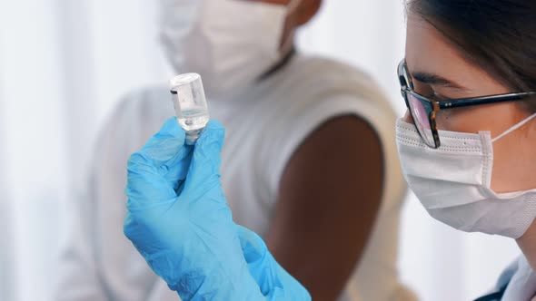 Young Man Visits Skillful Doctor at Hospital for Vaccination