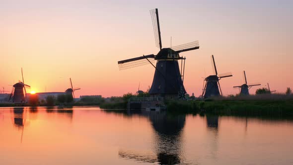 Netherlands Windmills on Rural Lanscape at Famous Tourist Site Kinderdijk in Holland on Sunset with