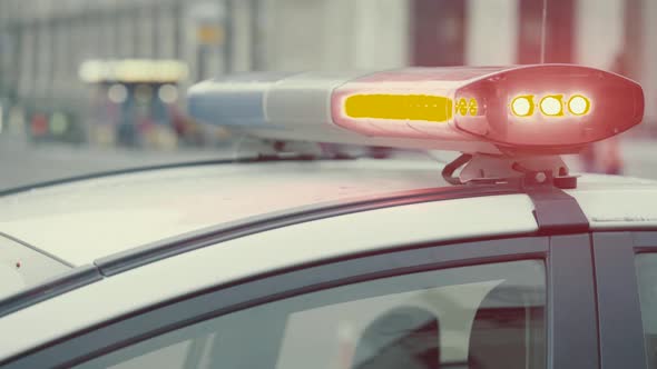 Flashing Flasher on the Roof of a Police Car. Blinker. Close-up.