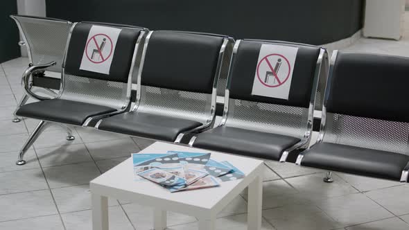 Empty Hospital Reception with Nobody Sitting on Chairs at Clinic