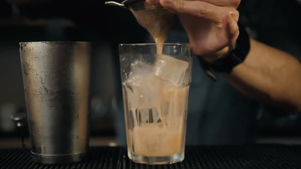 Young Professional Bartender Preparing Cocktails Outside Close Up Slow Motion Pouring Shaker