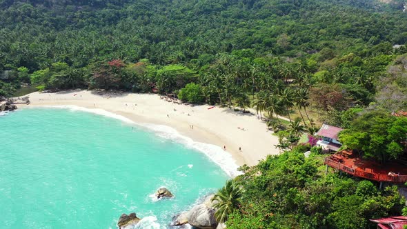 Tropical drone island view of a sunshine white sandy paradise beach and aqua blue ocean background i