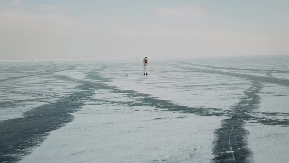 Stylish Young Woman Professional Dancer Dancing Energetic Jazz Funk or Hip Hop on Arctic Frozen Lake