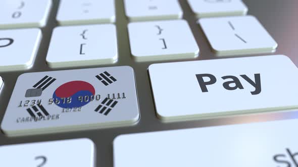 Bank Card with Flag of South Korea As a Key on Keyboard alt